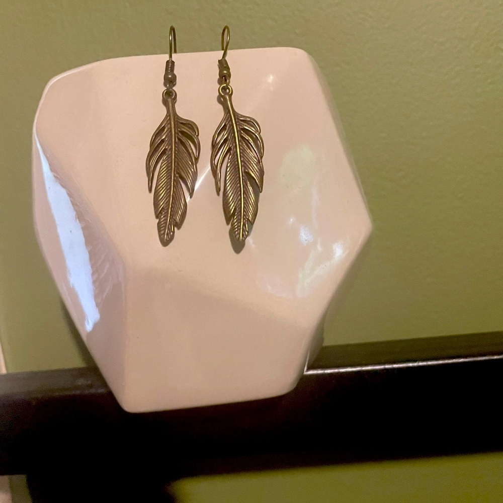 Bronze colored feather dangle earrings